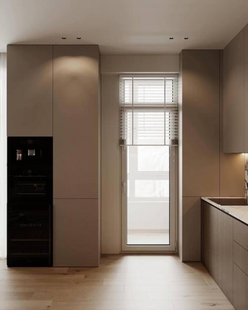 Интерьер кухни - гостиной в тёплых оттенках, тёмные приглушенные оттенки и мягкий свет создают атмосферу спокойствия и умиротворения. 04