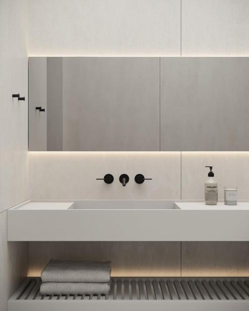 Монохромные поверхности и минималистичные формы в сочетании с контурной подсветкой и заливающий светом придают дизайну санузла футуризм. 01