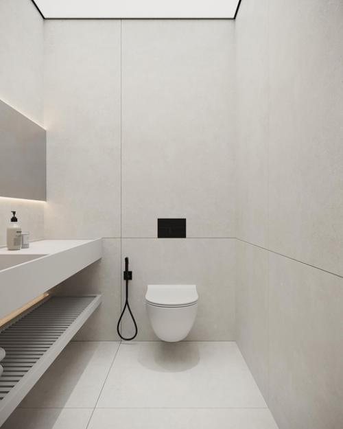 Монохромные поверхности и минималистичные формы в сочетании с контурной подсветкой и заливающий светом придают дизайну санузла футуризм. 02