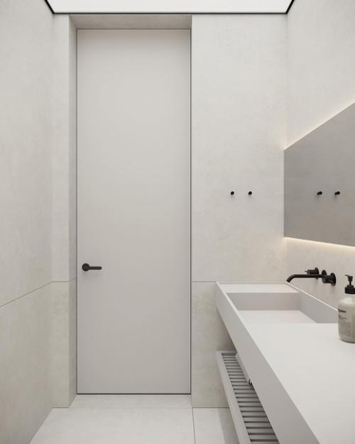Монохромные поверхности и минималистичные формы в сочетании с контурной подсветкой и заливающий светом придают дизайну санузла футуризм. 04