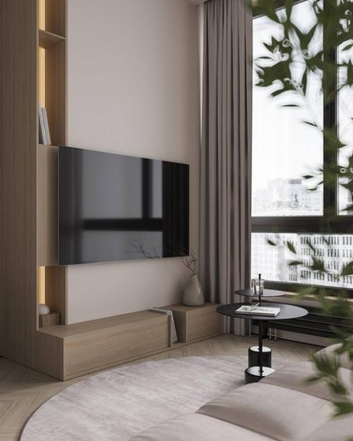 Гостиная в небольшой квартире, площадью 60 квадратных метров, с уютным интерьером предназначена для семьи из трех человек. 06