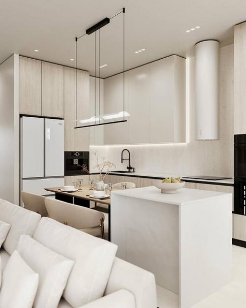Светлый интерьер просторной кухни - гостиной в спокойных монохромных тонах. 01