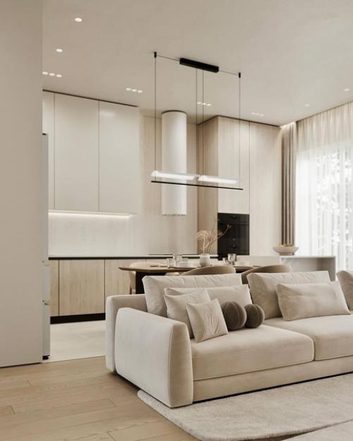 Светлый интерьер просторной кухни - гостиной в спокойных монохромных тонах. 04