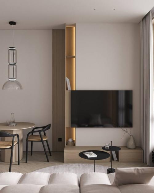 Гостиная в небольшой квартире, площадью 60 квадратных метров, с уютным интерьером предназначена для семьи из трех человек. 04