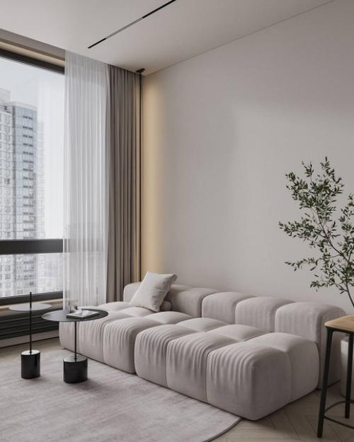 Гостиная в небольшой квартире, площадью 60 квадратных метров, с уютным интерьером предназначена для семьи из трех человек. 01