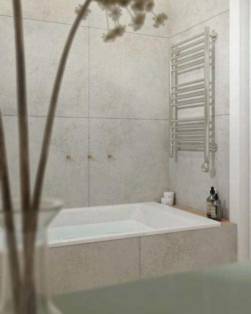 Минимализм, который работает на уют: в этой ванной комнате нет ничего лишнего, только чистые линии, естественные оттенки и продуманные детали. 04