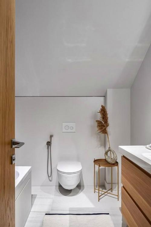 Загородный дом.  Интерьер, в котором бетон и кирпич без отделки соседствуют с минималистской мебелью и уютным текстилем. 07