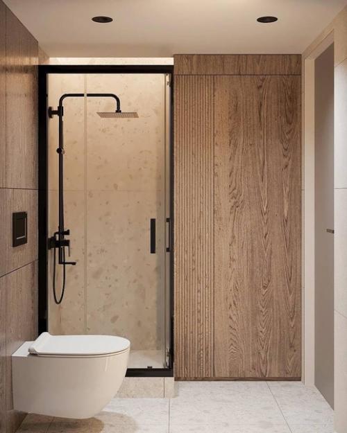 Светлый современный интерьер просторной ванной комнаты с душевой кабиной. 01