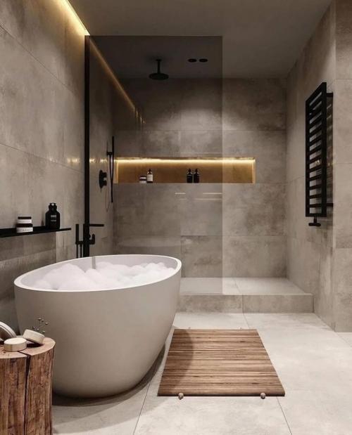 Однотонная плитка, темные аксессуары, белая ванна и продуманное освещение - вот что необходимо для элегантного и сбалансированного интерьера. 01