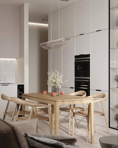 Светлый современный интерьер компактной кухни в приятной воздушной цветовой гамме. 02