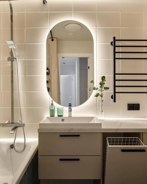 Интерьер современной квартиры, созданный для молодой пары, представляет собой светлое, уютное и спокойное пространство для совместного проживания. 09