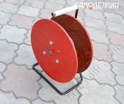 Органайзер для электрического кабеля в виде катушки. 08