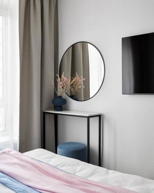 Интерьер современной квартиры, созданный для молодой пары, представляет собой светлое, уютное и спокойное пространство для совместного проживания. 08