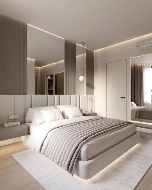 Уютная спальня в светлых тонах с очень интересной подсветкой кровати. 01