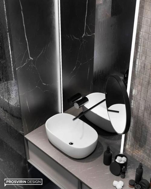 Дизайн санузла в темных оттенках сморится очень стильно и смело. 01