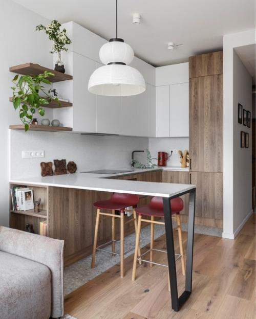 Используя теплые оттенки и природные материалы, небольшую квартиру превратили в идеальное место для отдыха после рабочего дня. 02