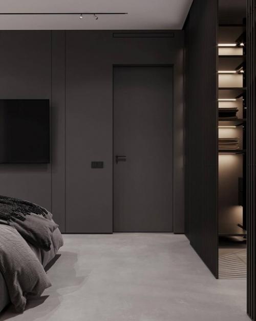 Брутальный интерьер спальни в тёмных тонах и с ярким акцентом на стене. 04