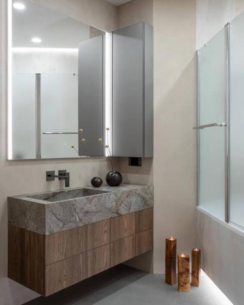 Современный интерьер однокомнатной квартиры с минимальным набором декора и интересным сочетанием цветов. 07