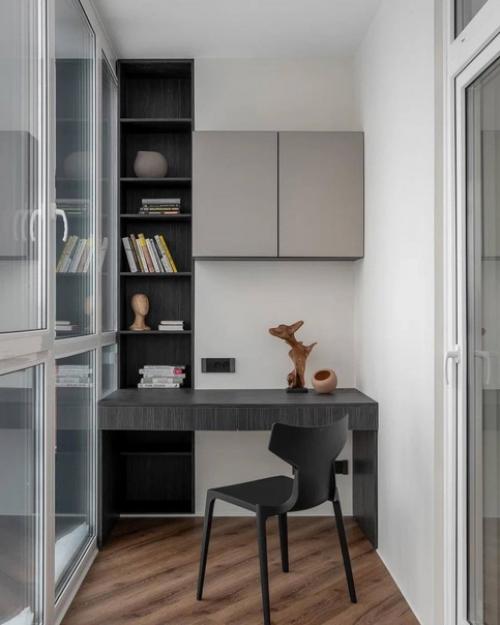 Современный интерьер однокомнатной квартиры с минимальным набором декора и интересным сочетанием цветов. 06