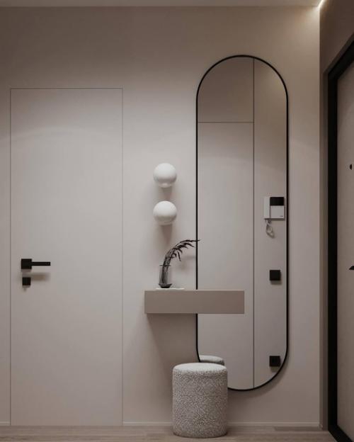 Интерьер лаконичной прихожей и кухни - гостиной площадью 26 квадратных метров в светлом исполнении. 05