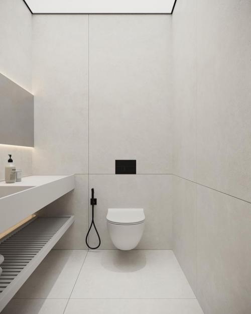 Монохромные поверхности и минималистичные формы в сочетании с контурной подсветкой и заливающий светом придают дизайну санузла футуризм. 01
