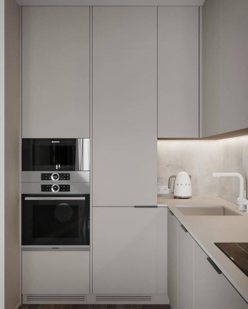 Интерьер лаконичной прихожей и кухни - гостиной площадью 26 квадратных метров в светлом исполнении. 01