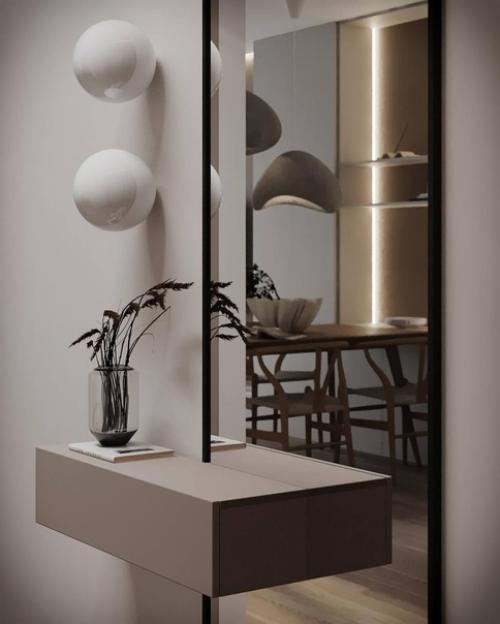 Интерьер лаконичной прихожей и кухни - гостиной площадью 26 квадратных метров в светлом исполнении. 06