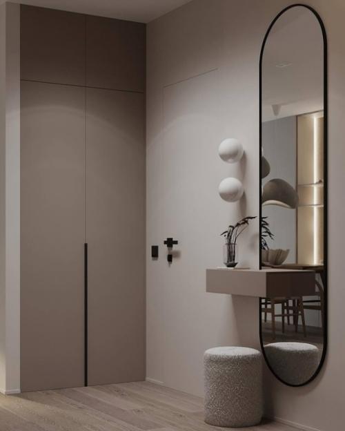 Интерьер лаконичной прихожей и кухни - гостиной площадью 26 квадратных метров в светлом исполнении. 09