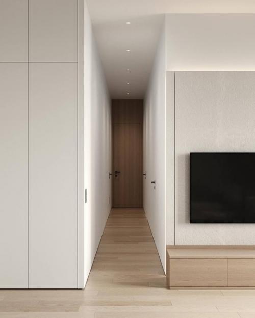 Аскетичный, но в тоже время уютный интерьер кухни - гостиной. 06