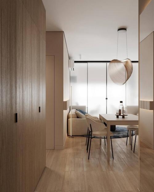 Интерьер кухни - гостиной в теплых тонах создает приятную и уютную атмосферу, идеальную для семейного отдыха и приема гостей. 05