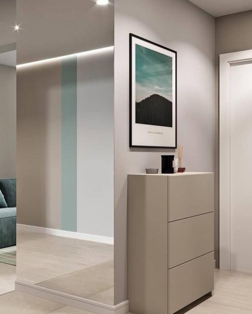 Интерьер квартиры, выполненный в спокойных тонах, помогает создать атмосферу уюта и спокойствия. 05